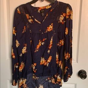 Blue top with orange and white flowers